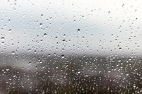 Closeup of raindrops on a closed window